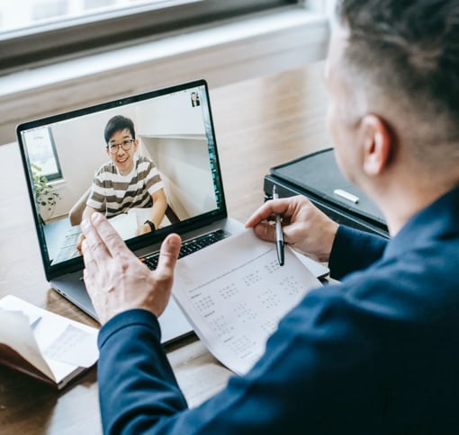 two men video chatting via tablet